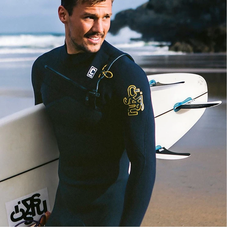 Man with surf board on the beach
