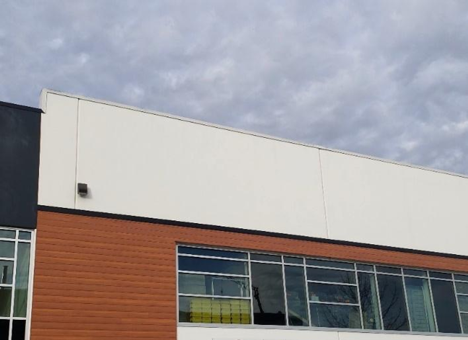 Same building, coated white with the same efflorescence as the black coating but far less visible and unsightly.