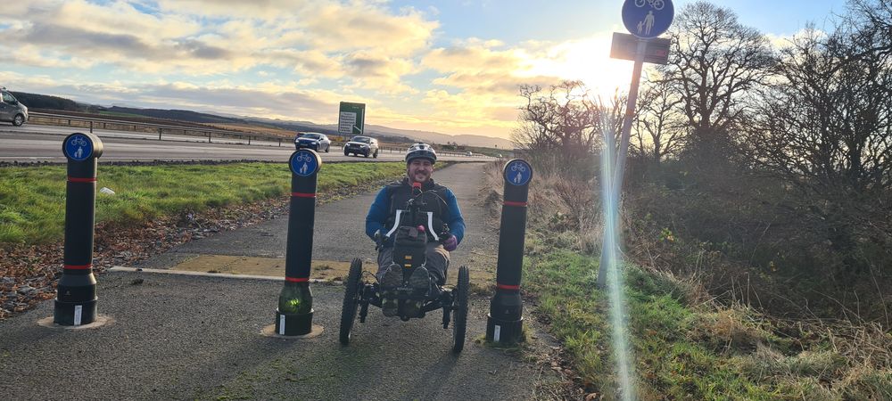 photo showing an adpative rider using the NCN Route 77 at Bankfoot