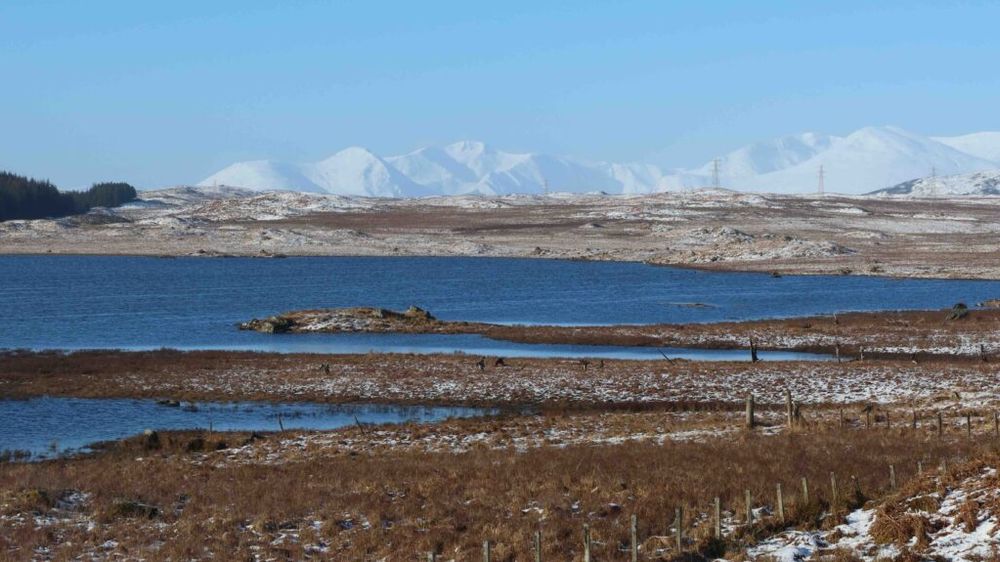 Loch Eighaech and snow-capped mountains south of Rannoch Forest