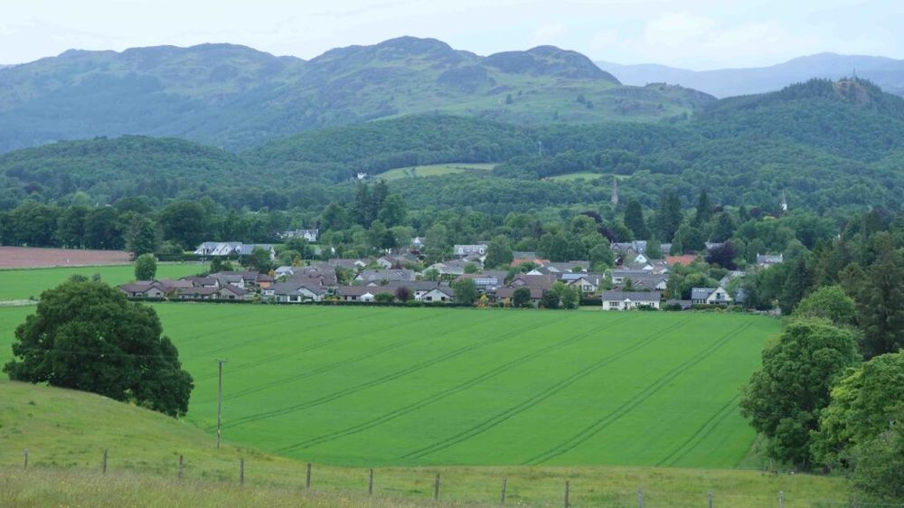 Comrie from the south, with the Highlands looming in the background