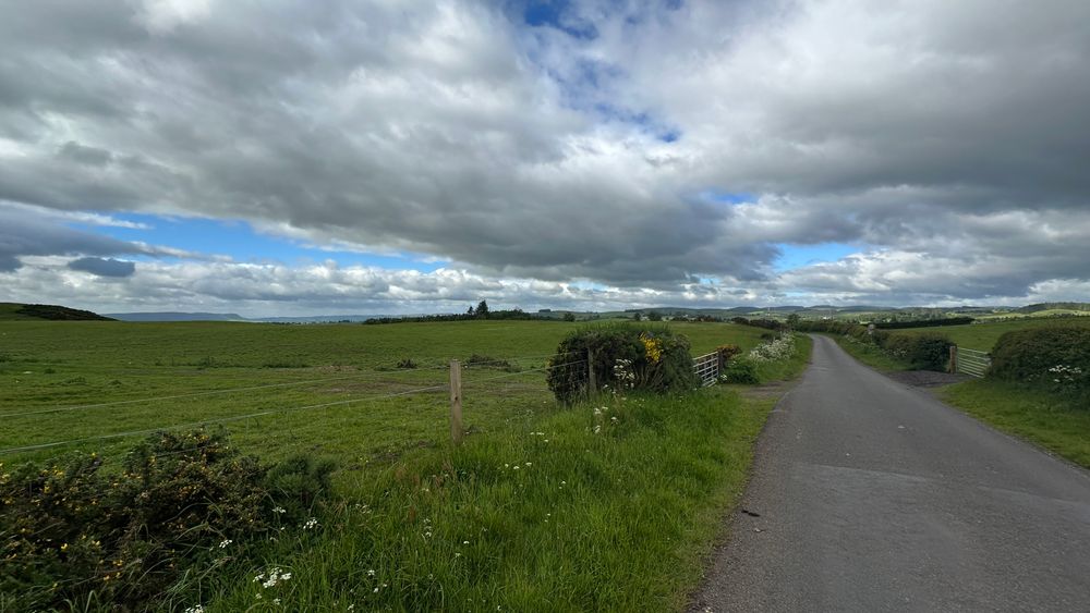 A country road with hills around