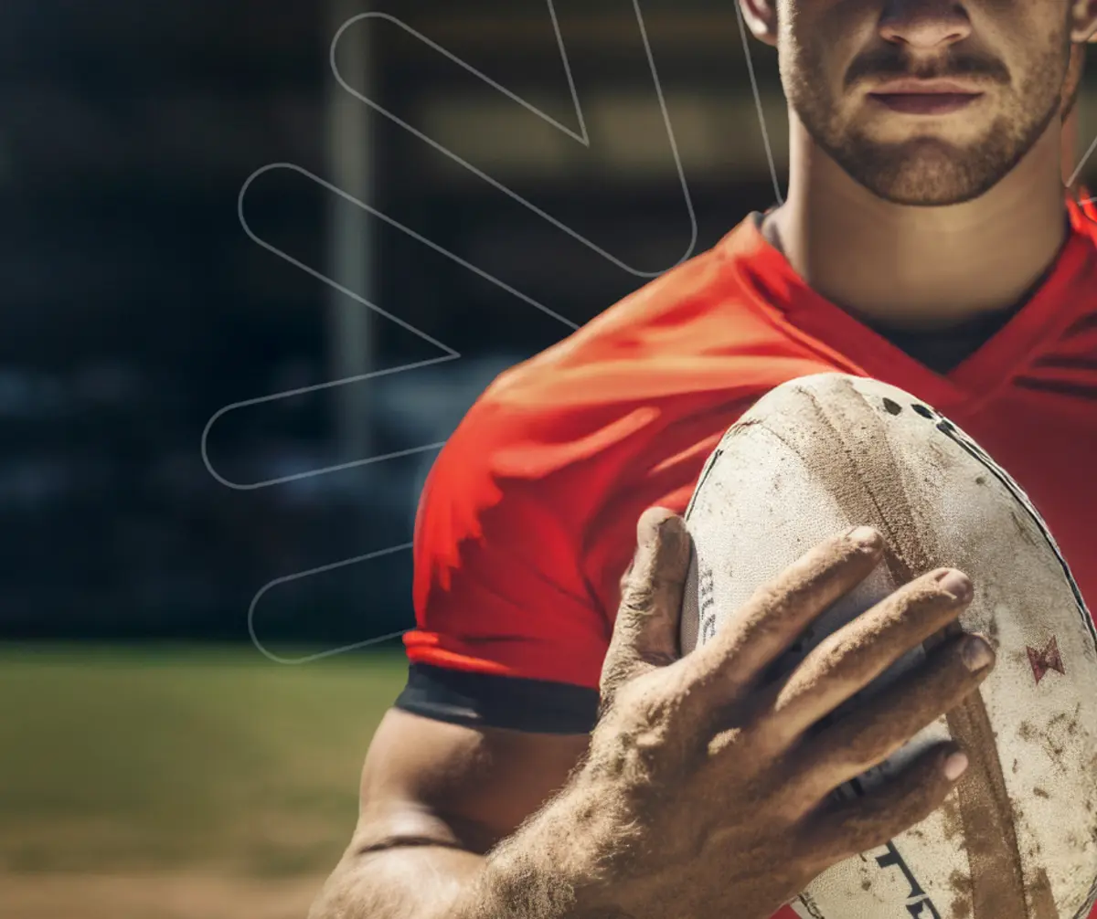 Aviso Group Player of the Game holding an NRL football