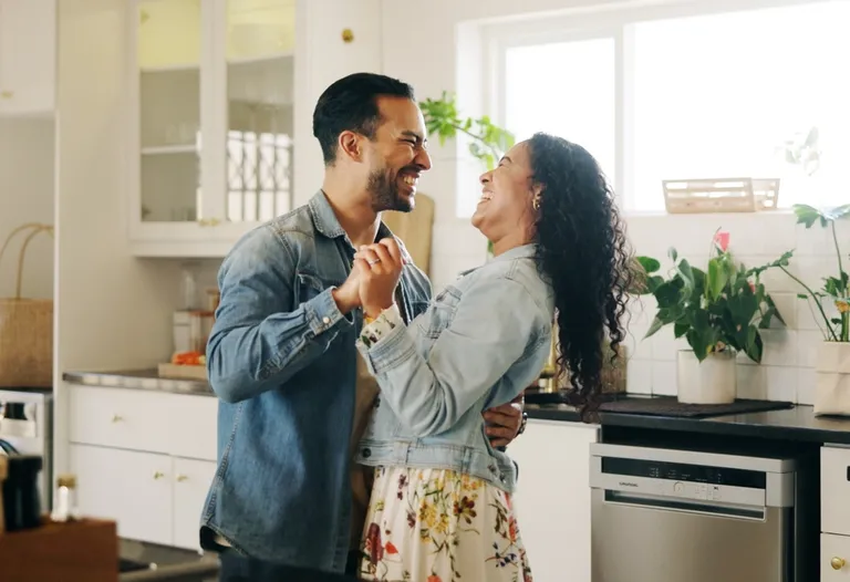 couple dancing in kitchen