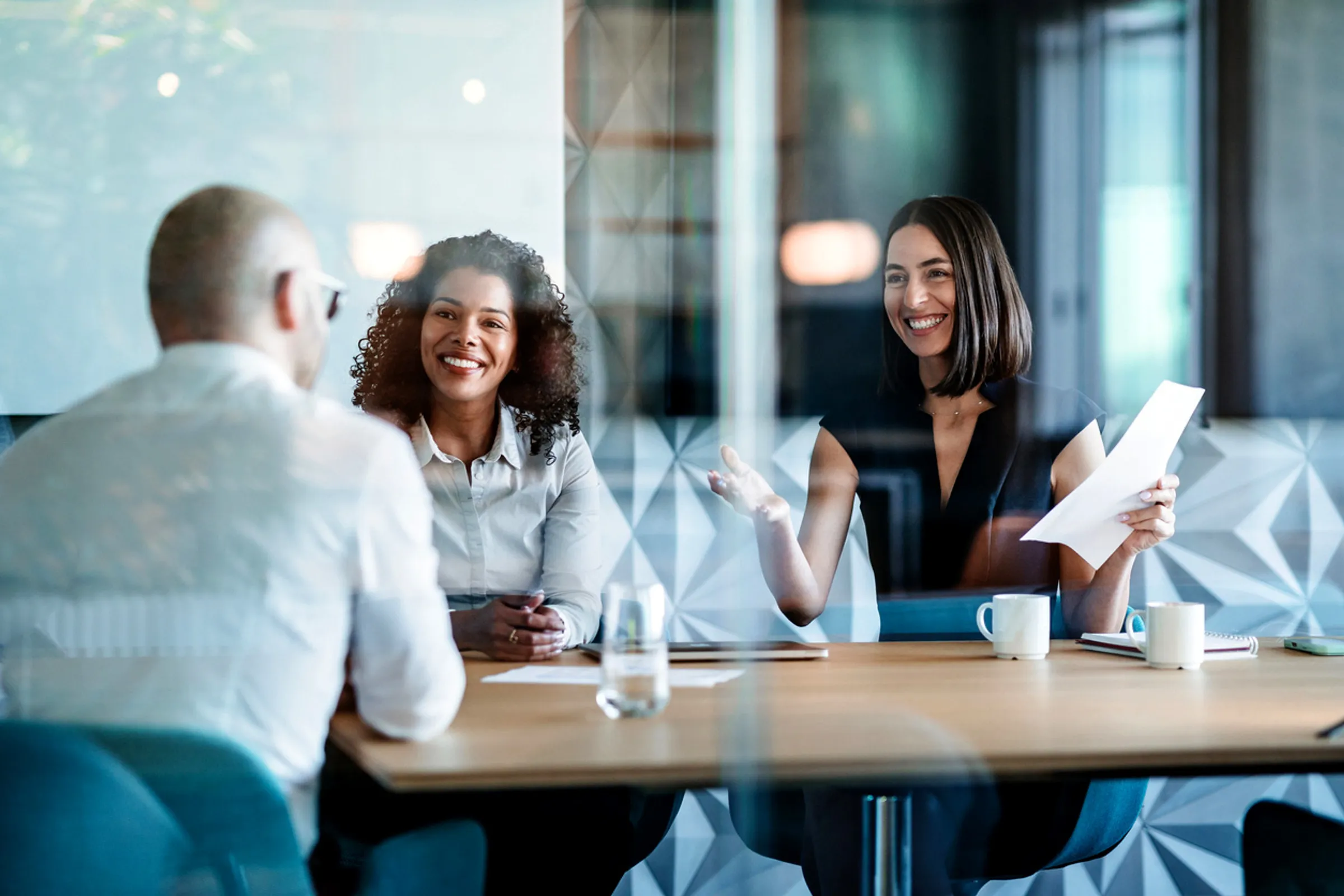 Two professional women in a client meeting