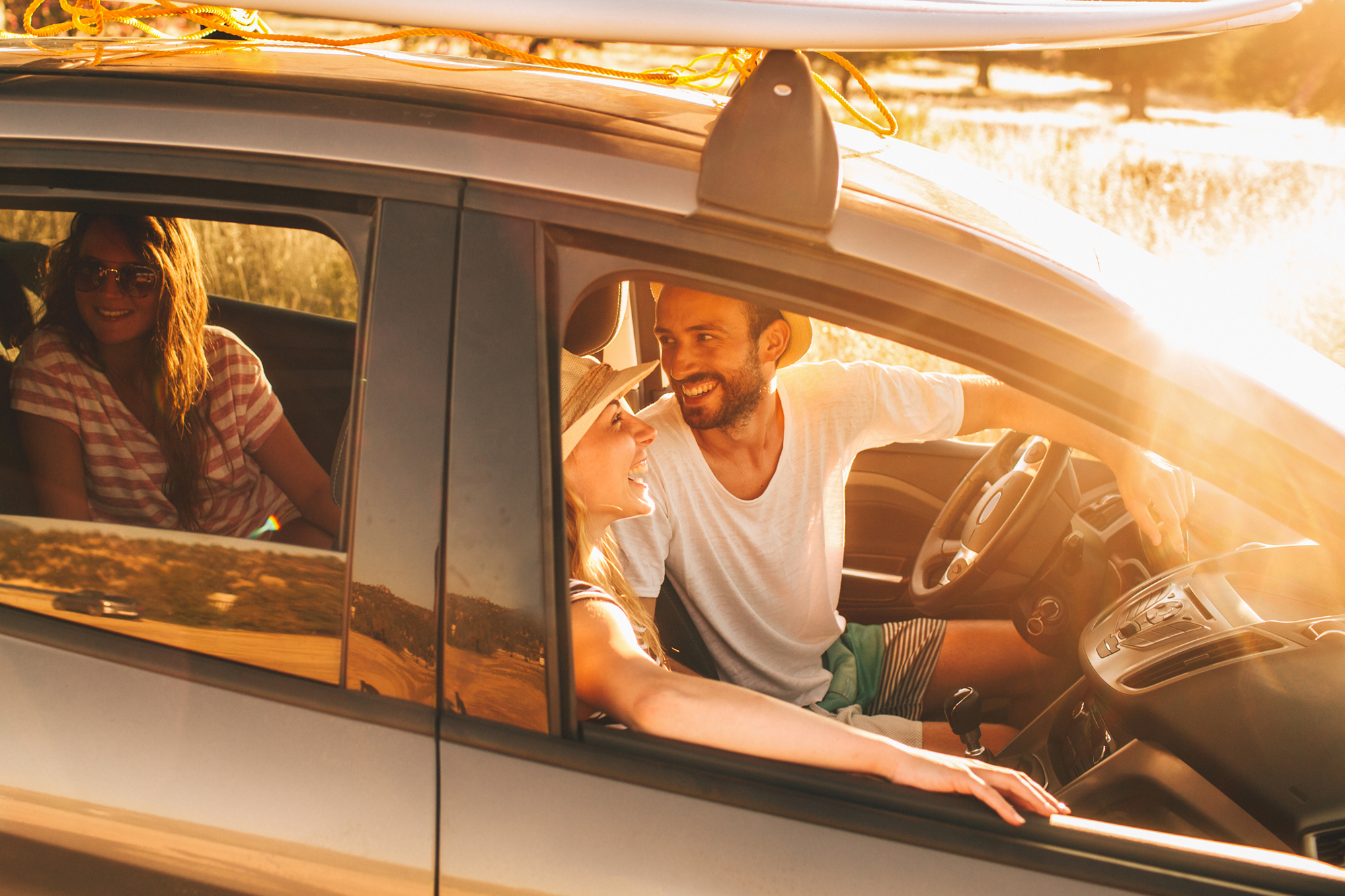 People in car sunset