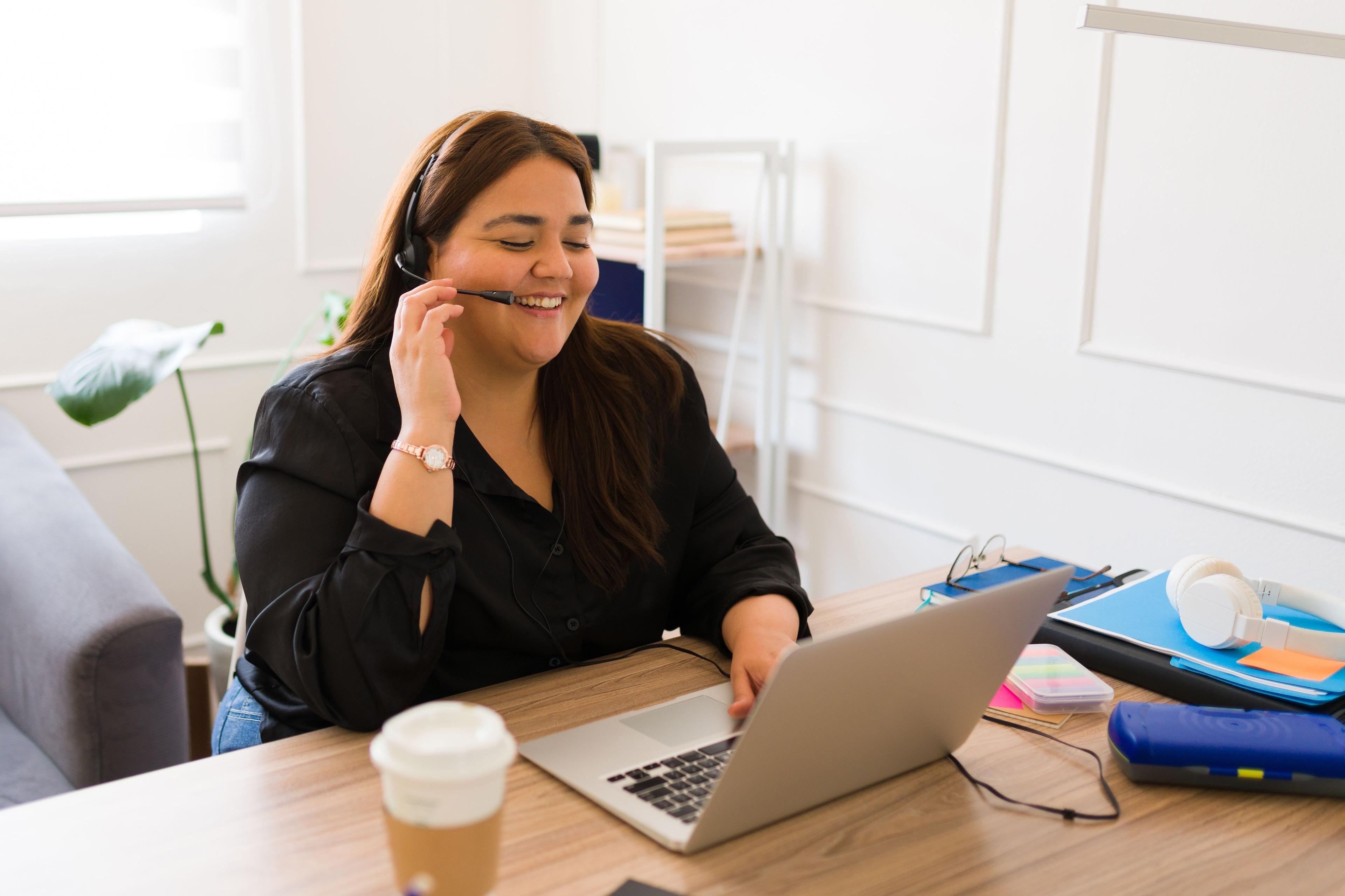 Person sat at desk highlighting sedentary work
