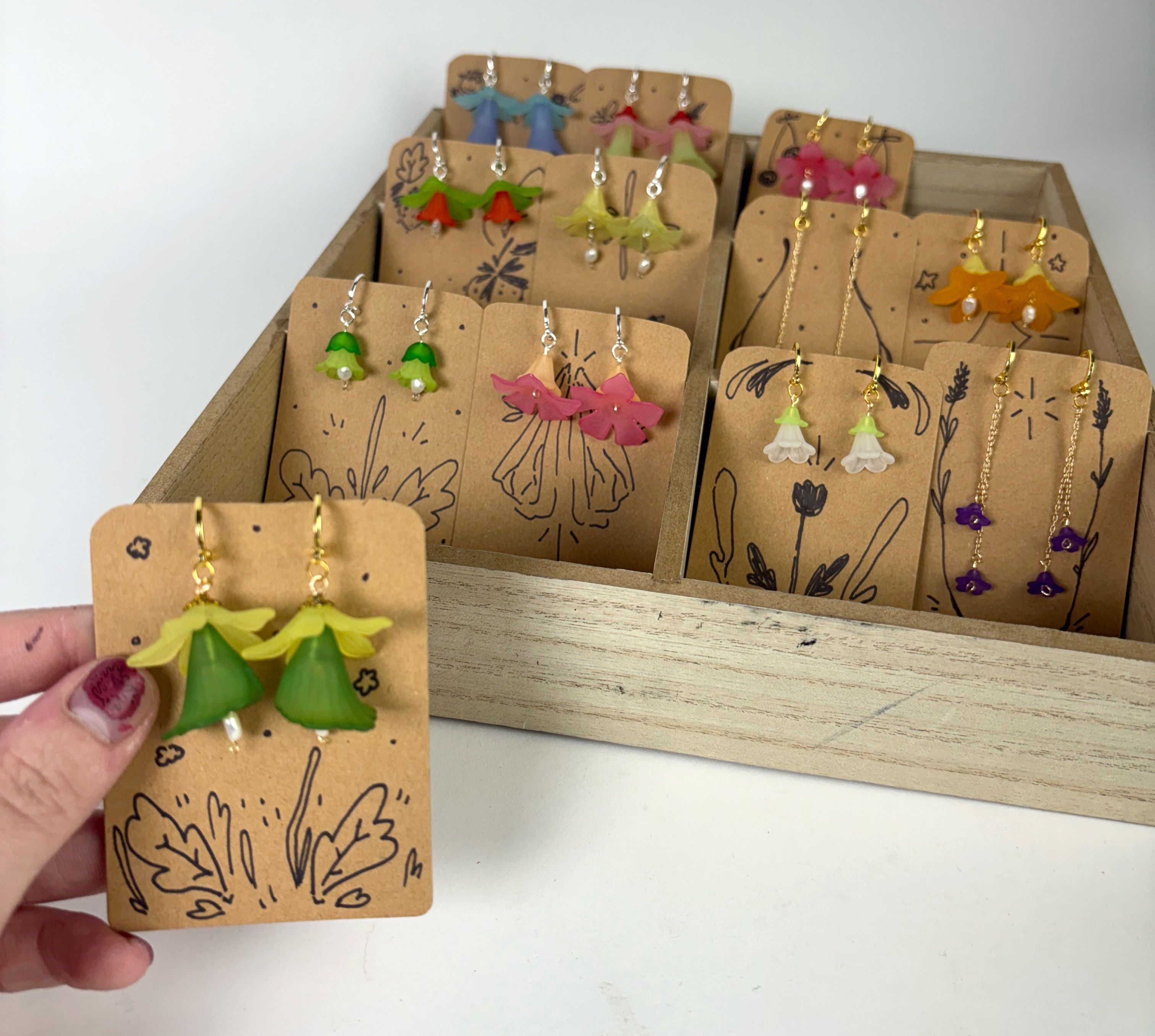 A display of earrings with floral beads.