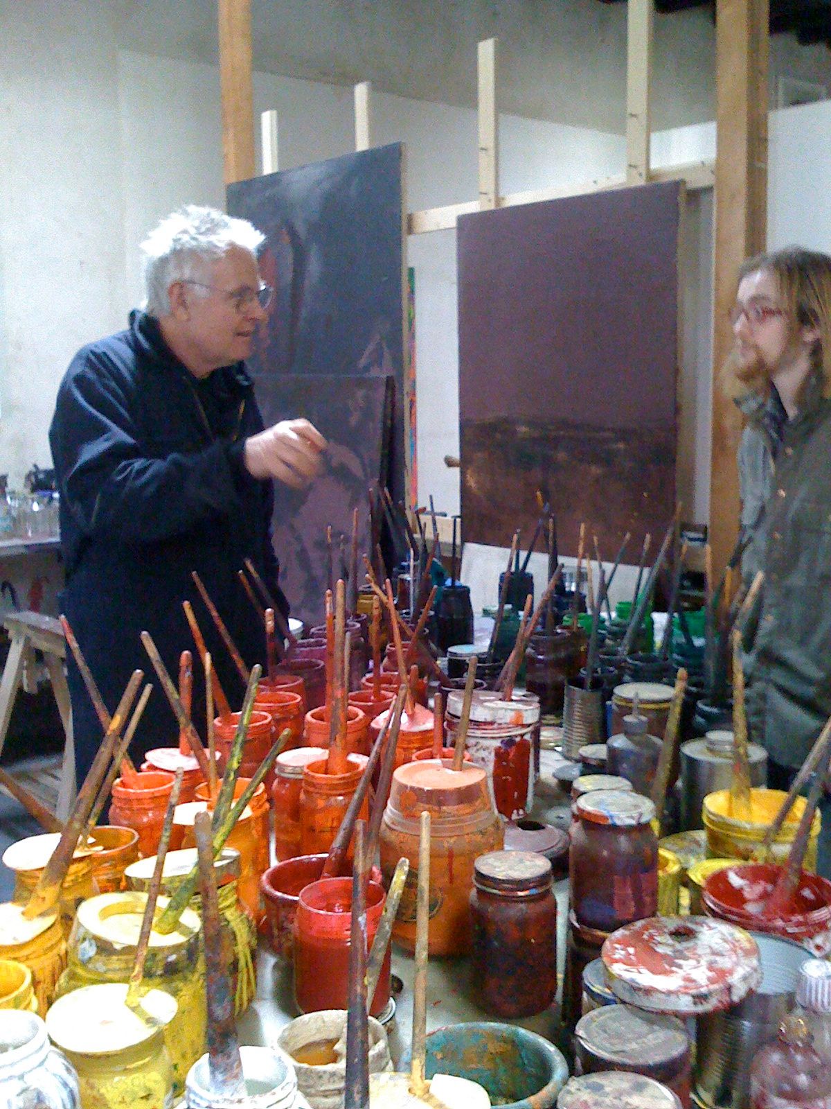 View of Bill Jensen's studio with many jars of paint.