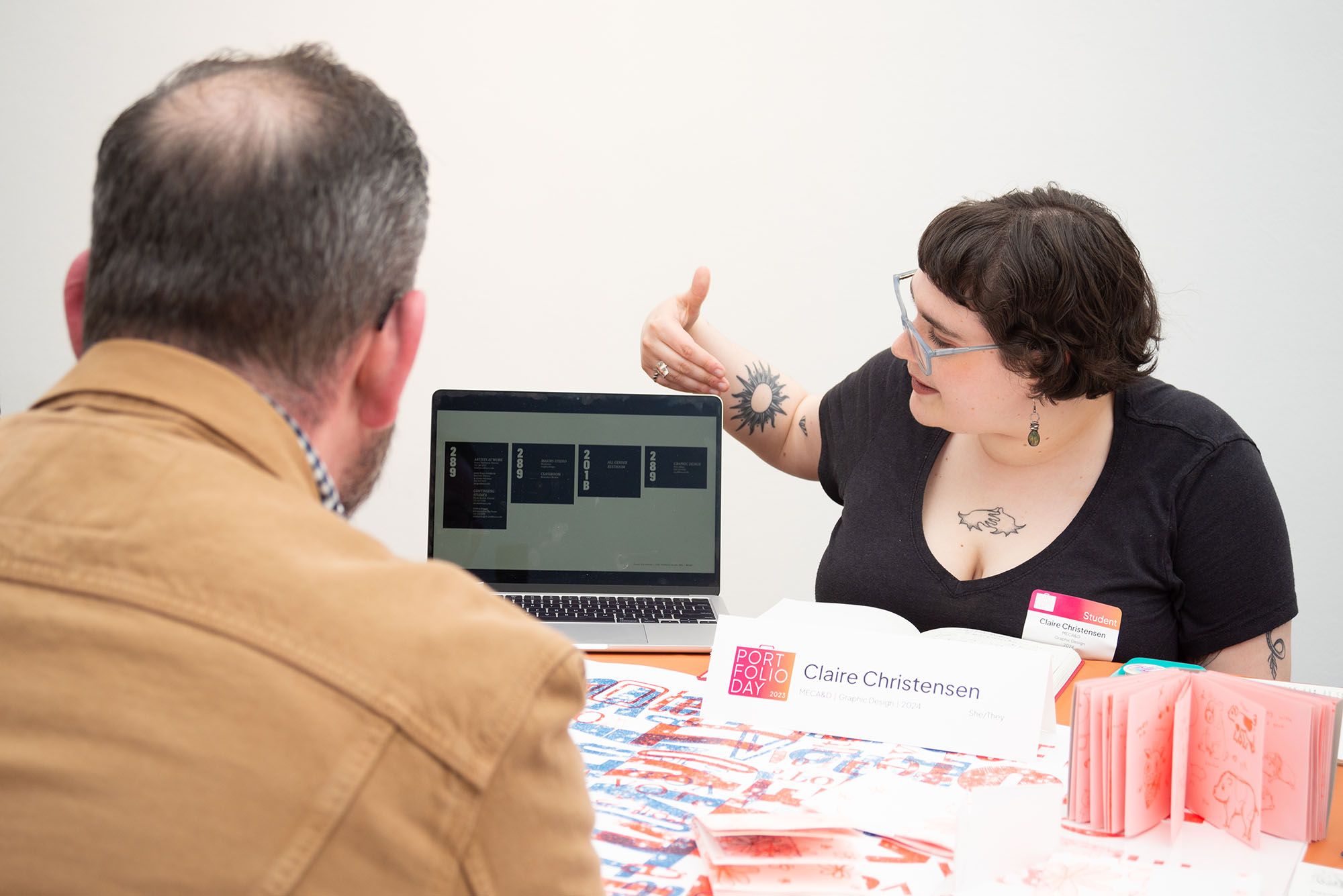 A student presenting their work during a Portfolio Day.