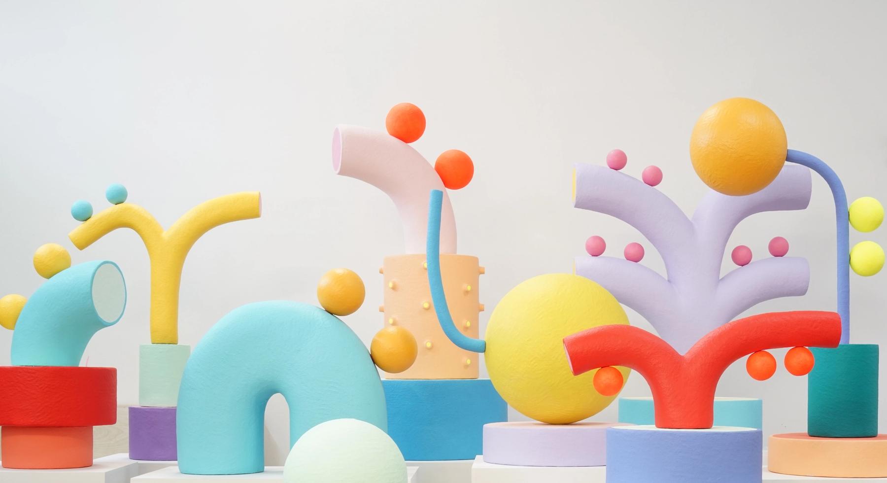 Brightly colored rounded abstract sculptures.