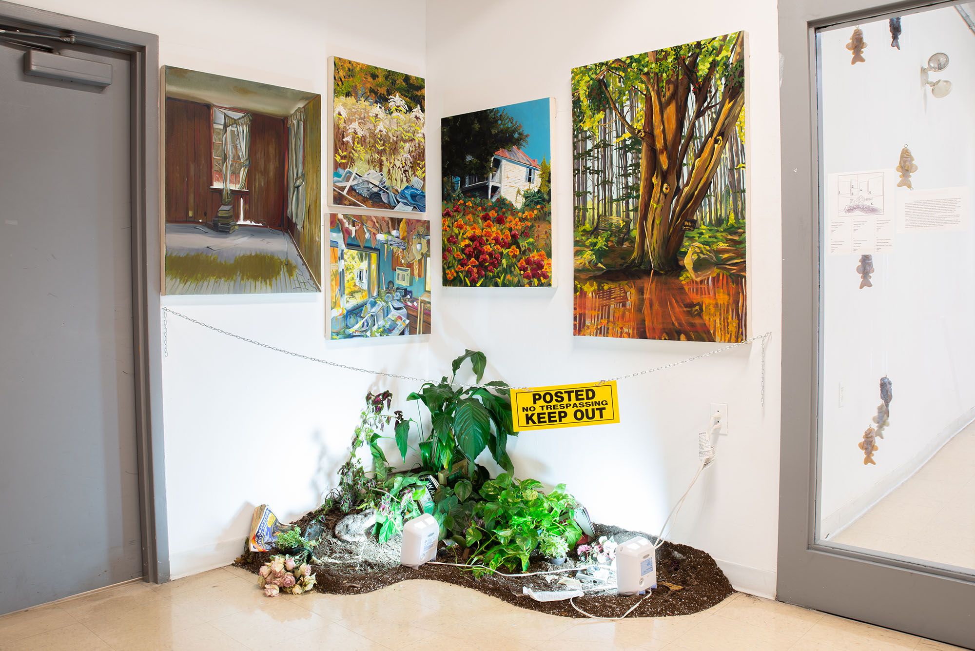 Five paintings depicting scenes of forrest and decay above an installaiton of dirt and plants market by a yellow sign that reads, "Posted no tresspassing keep out".