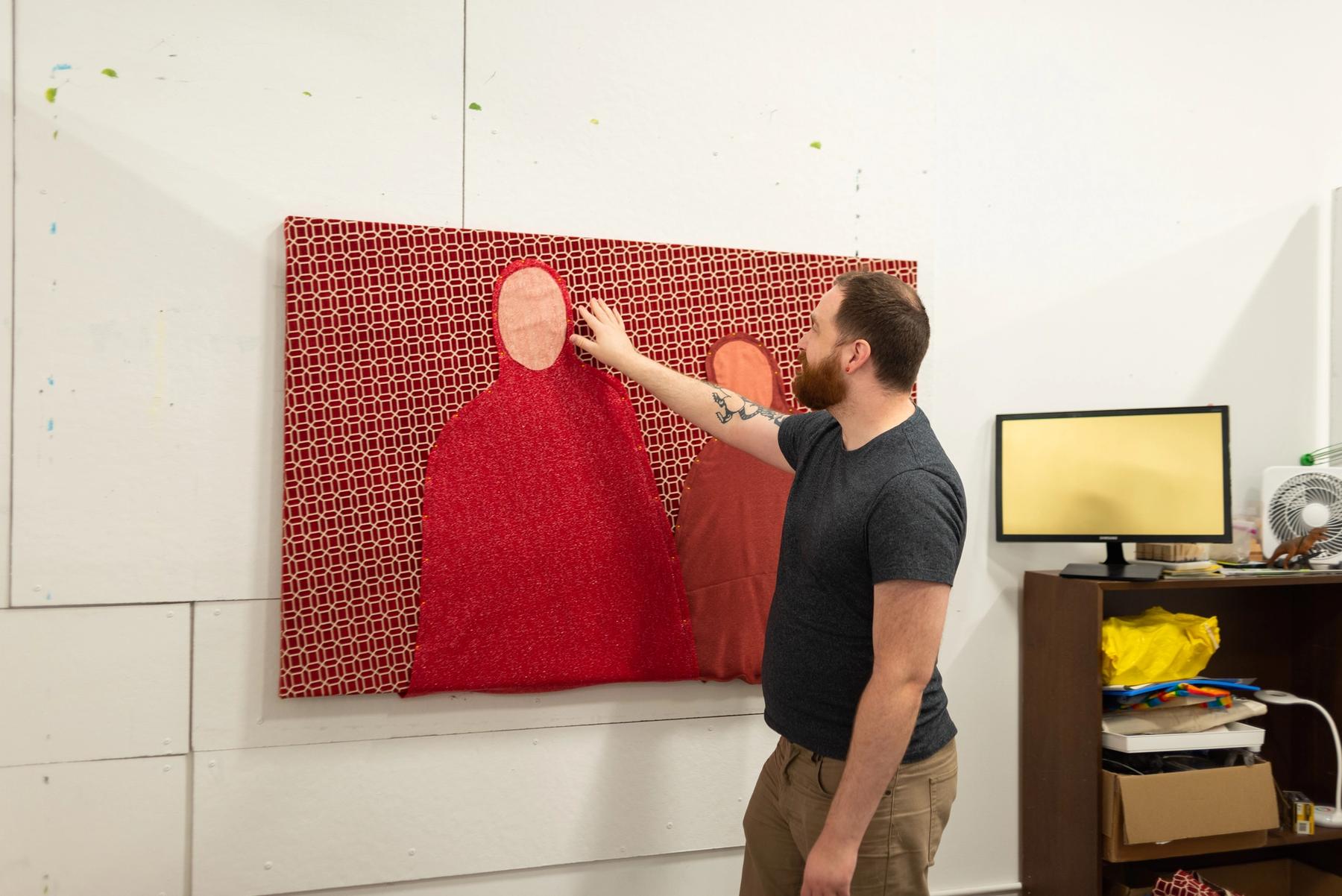 MFA student working on a project in their studio.