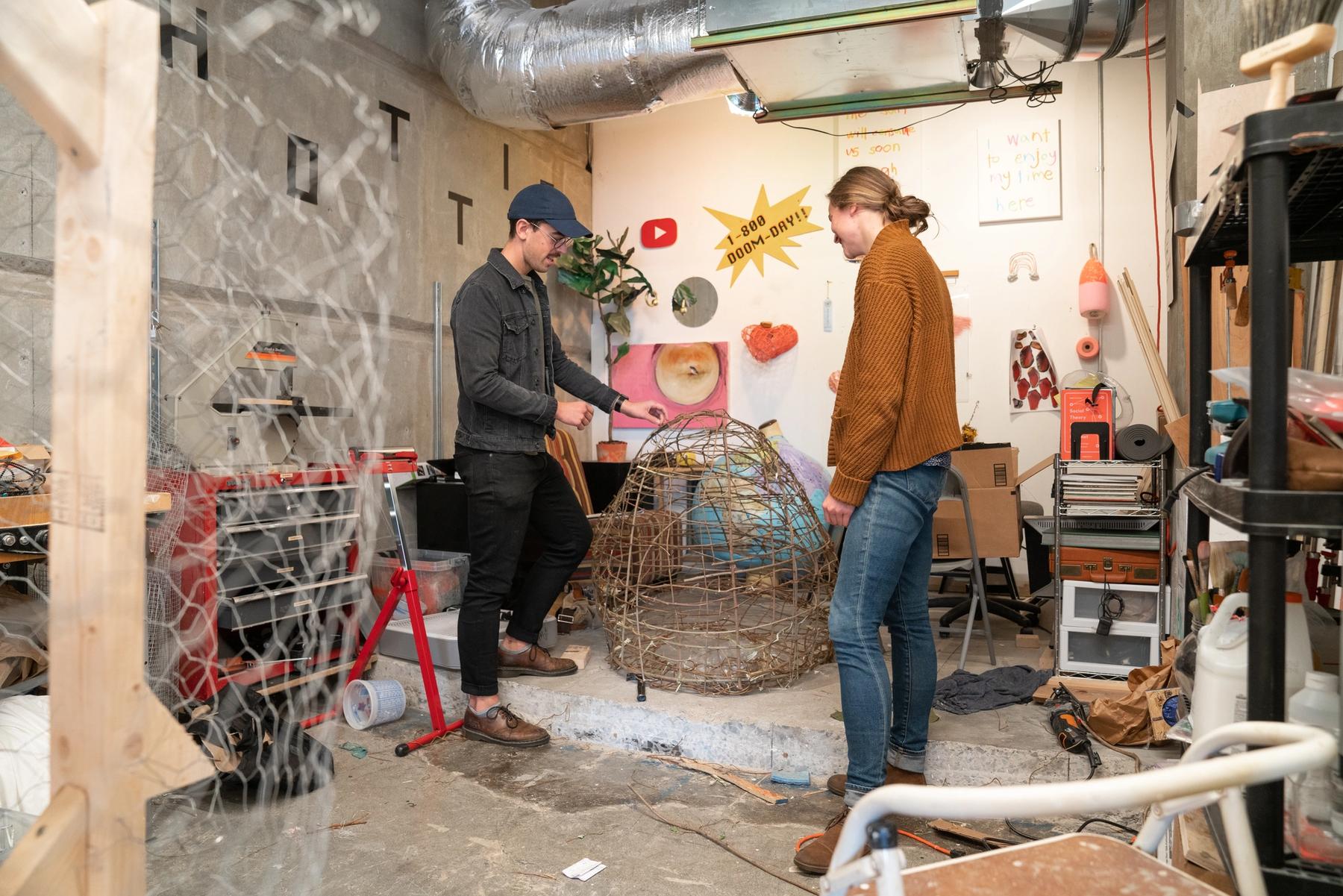 View of an MFA studio space with in-progress wire sculptures.