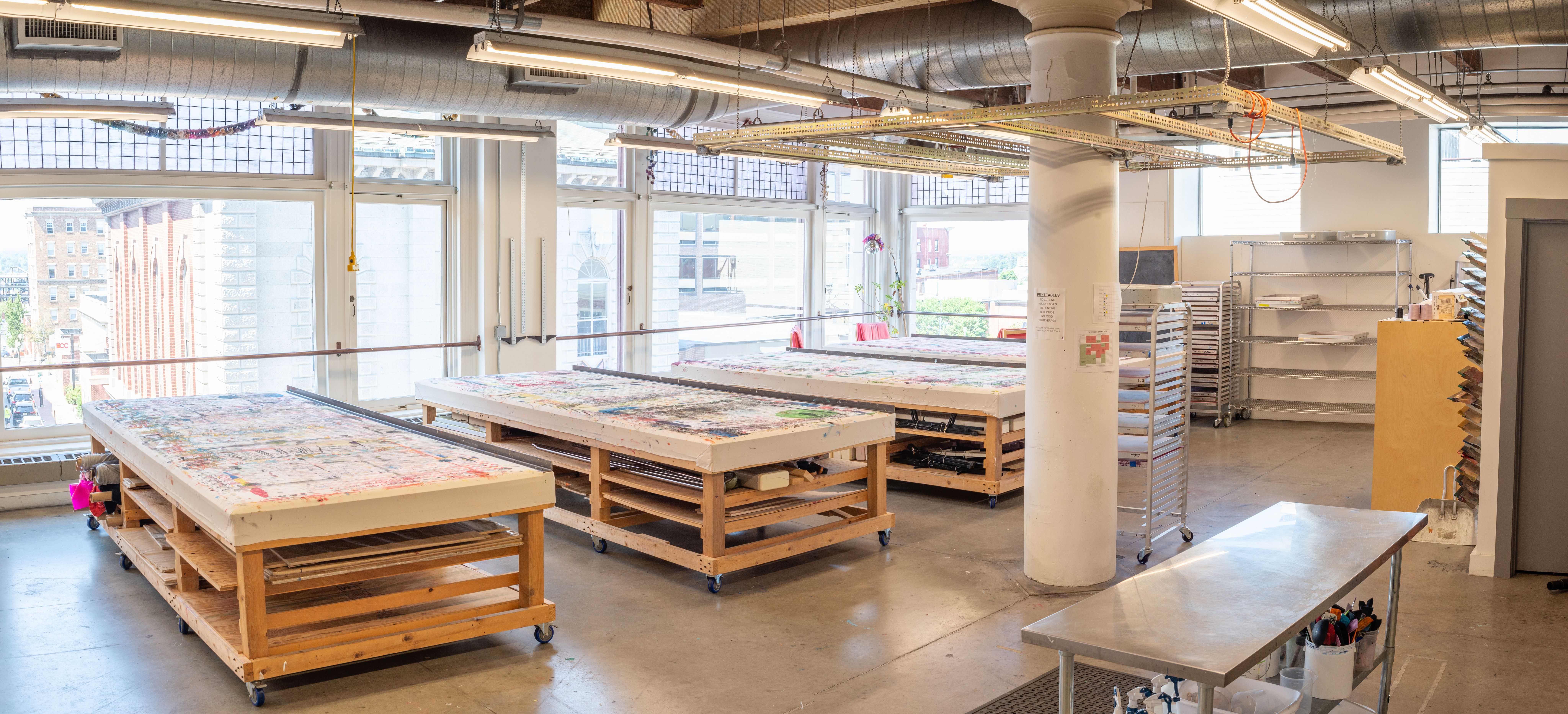 Textile and Fashion Design fabric printing tables in a well-lit spacious studio overlooking Congress Street.