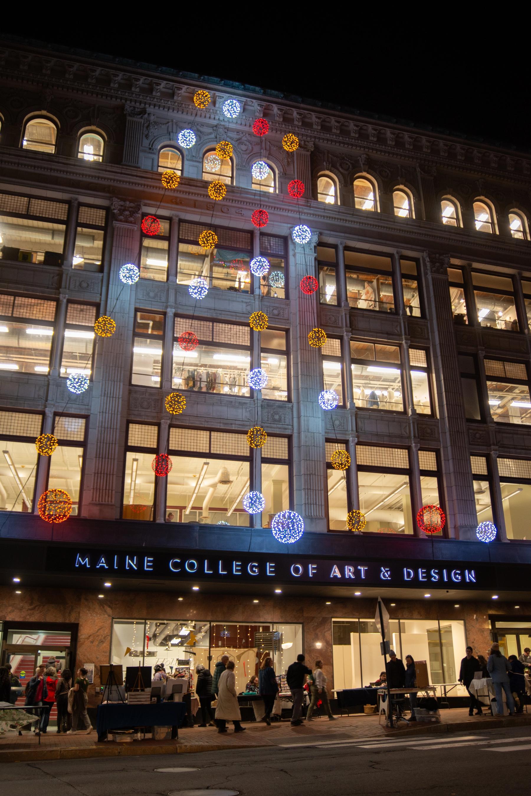 Exterior of MECA&D at night during Holiday Sale. Photo by Annabelle Collette '22.