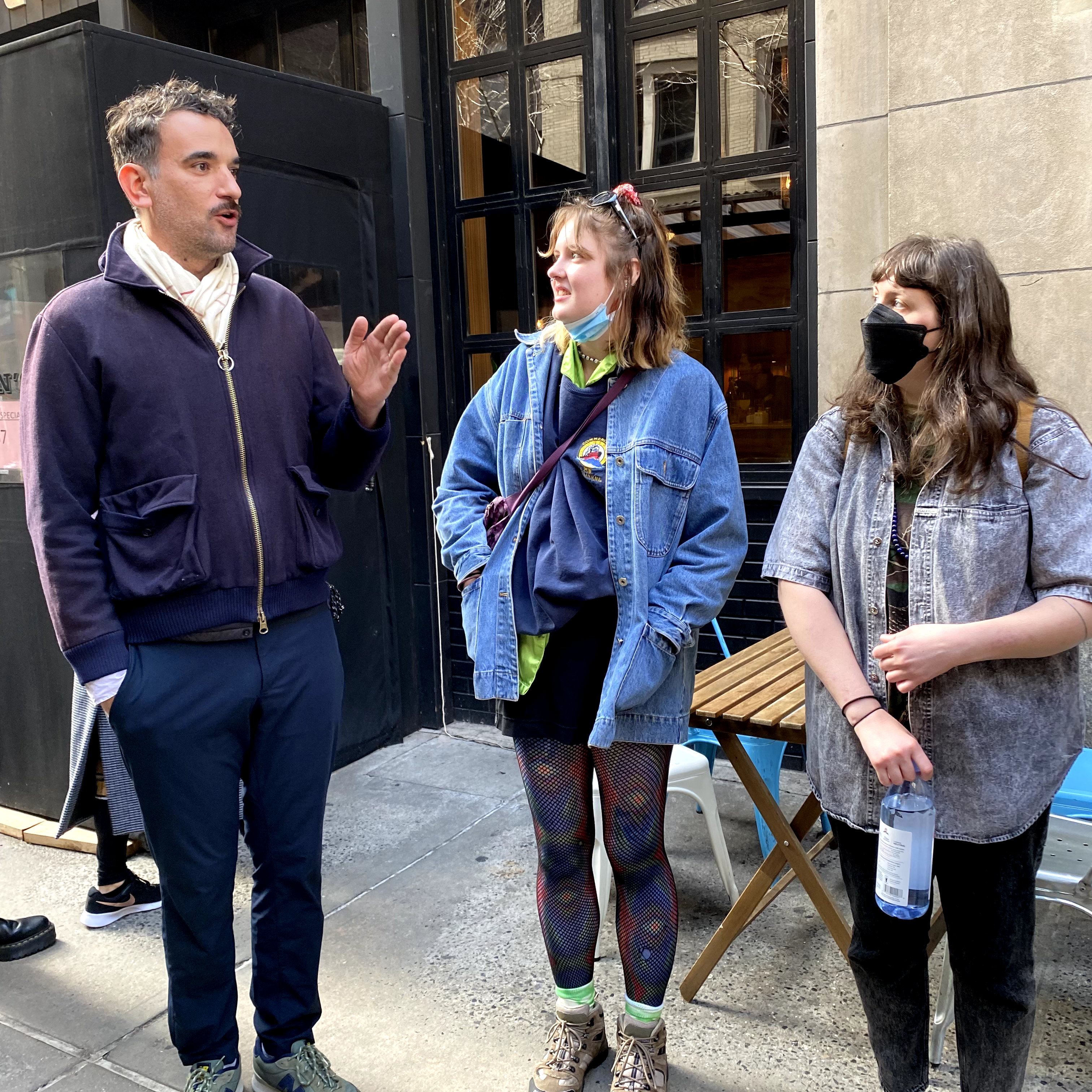 Three people talking