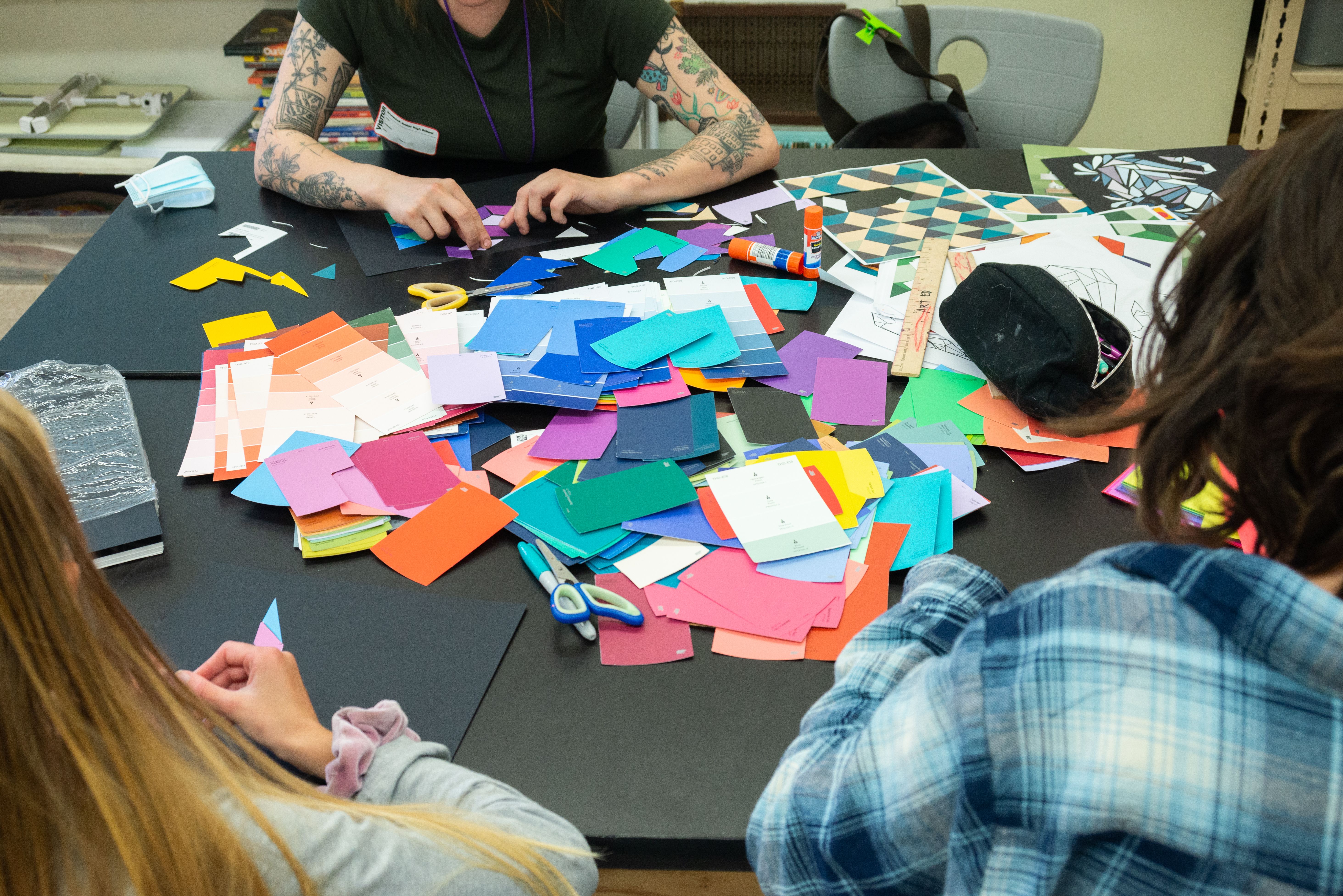 MAT student working on collage with children.