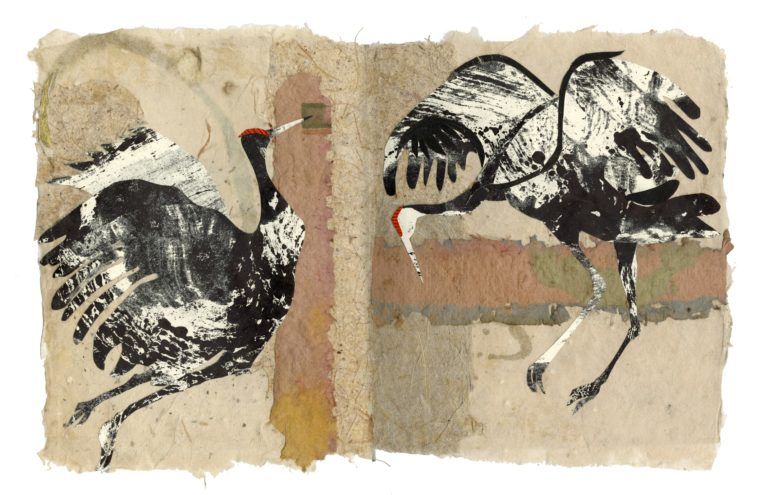 A collage of two cranes made from prints and handmade paper.