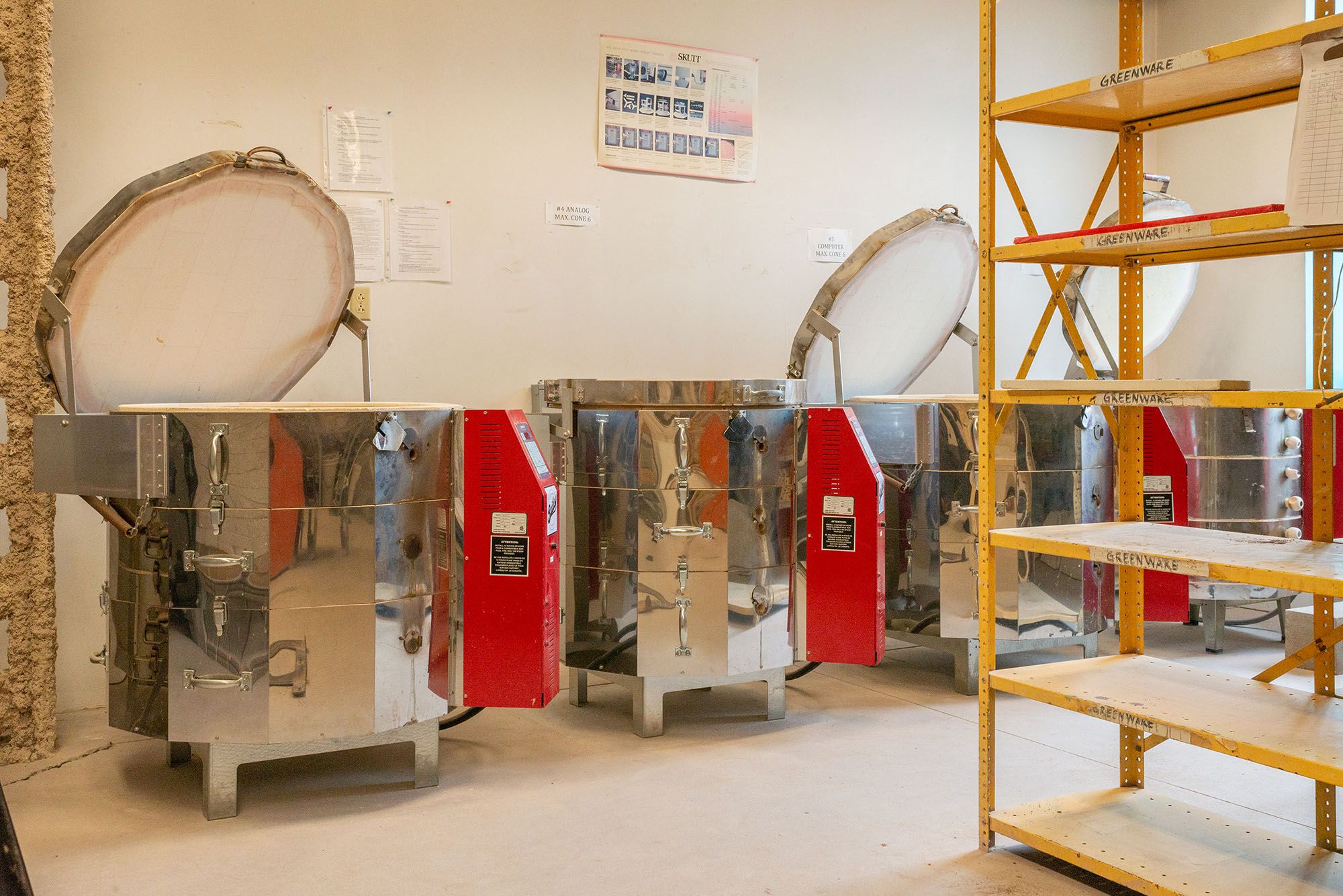 View of electric kilns in the kiln room.