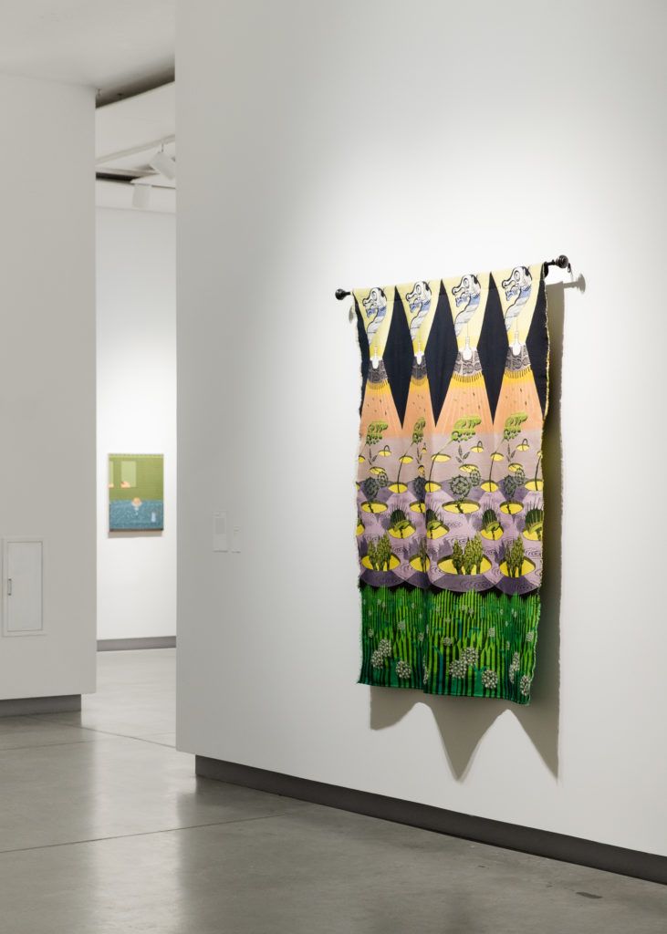 Gallery view of a hanging tapestry.