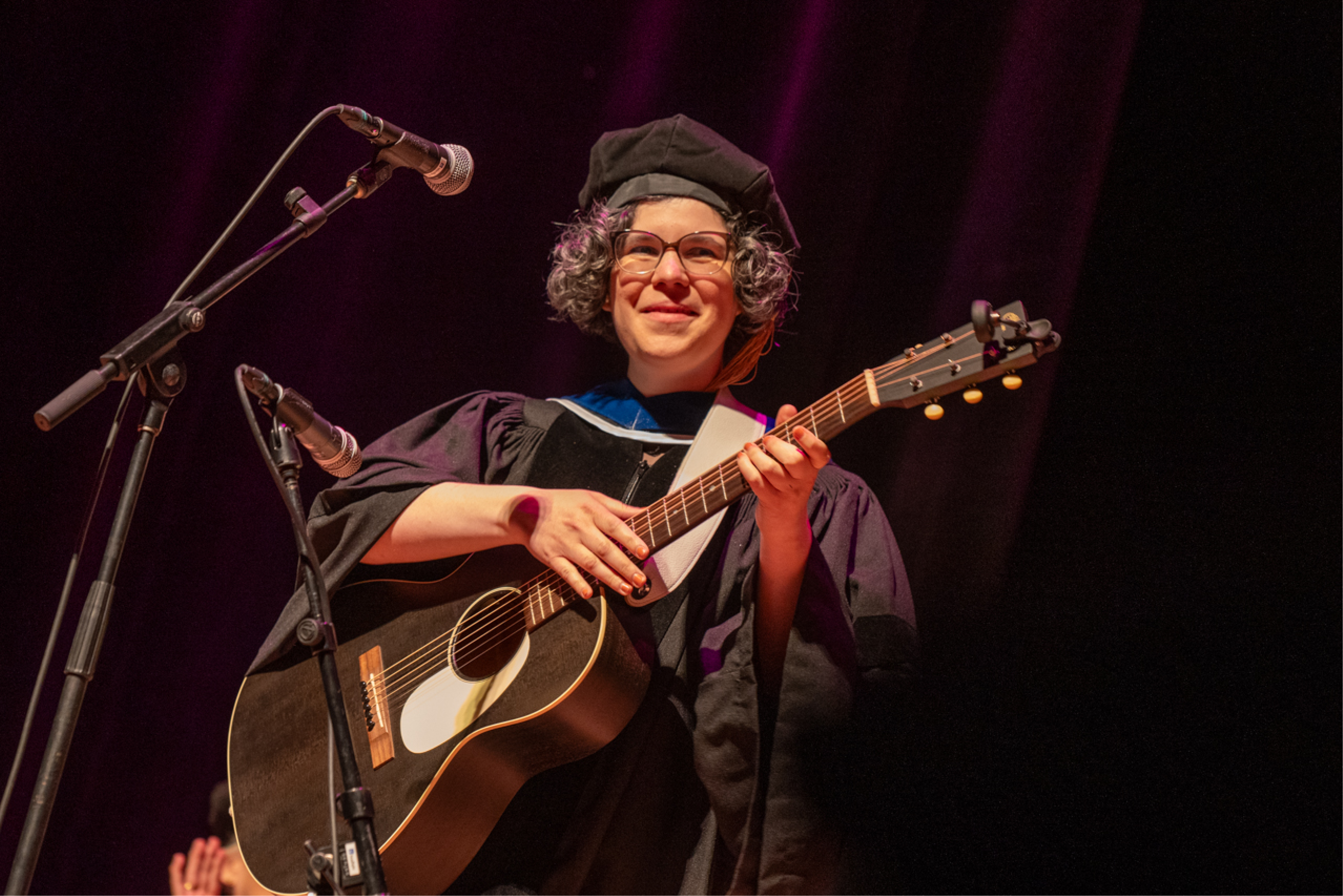 Commencement speaker Rebecca Sugar performing a song.