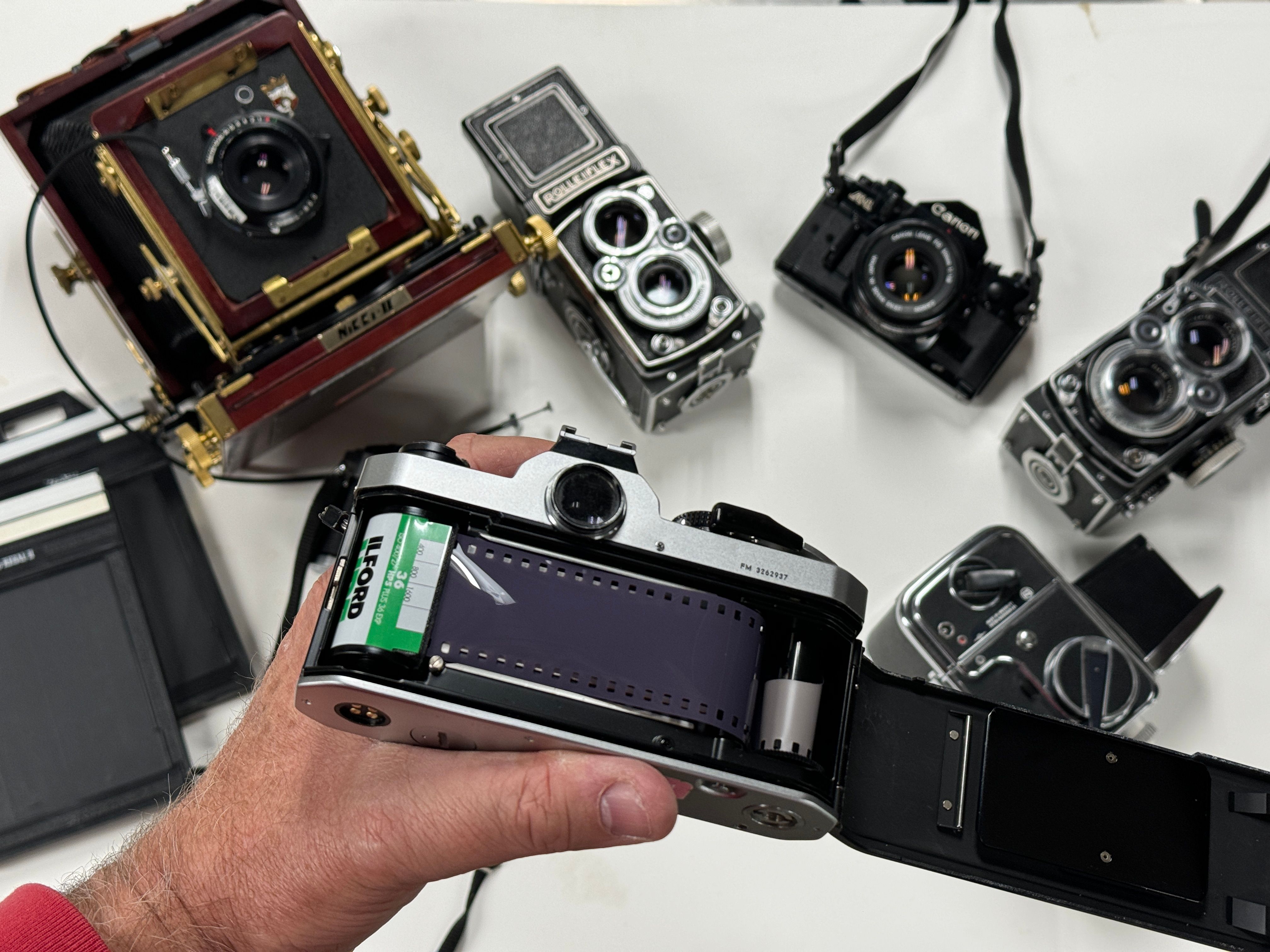 Seven different film cameras.