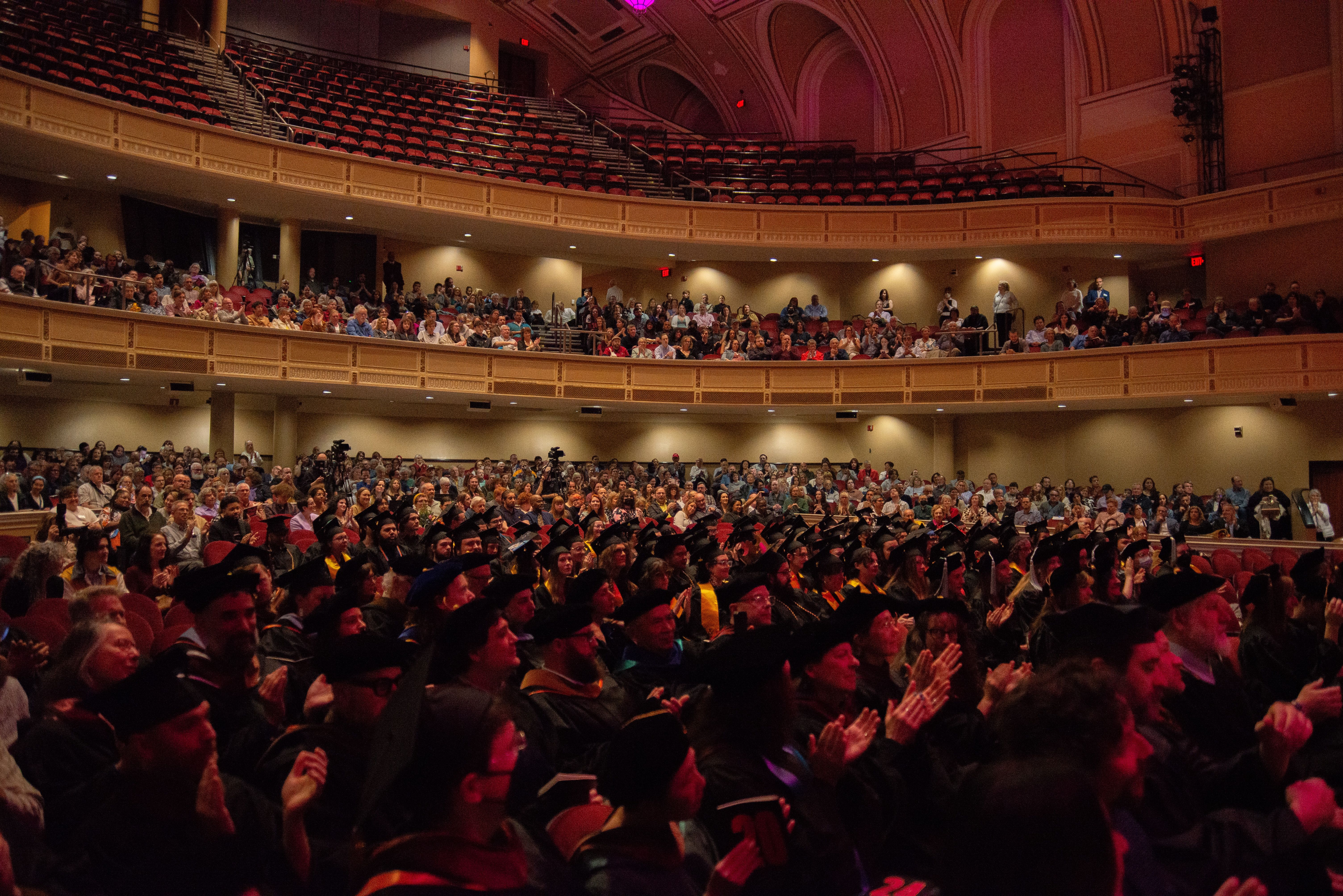 An auditorium full of graduating students and their families