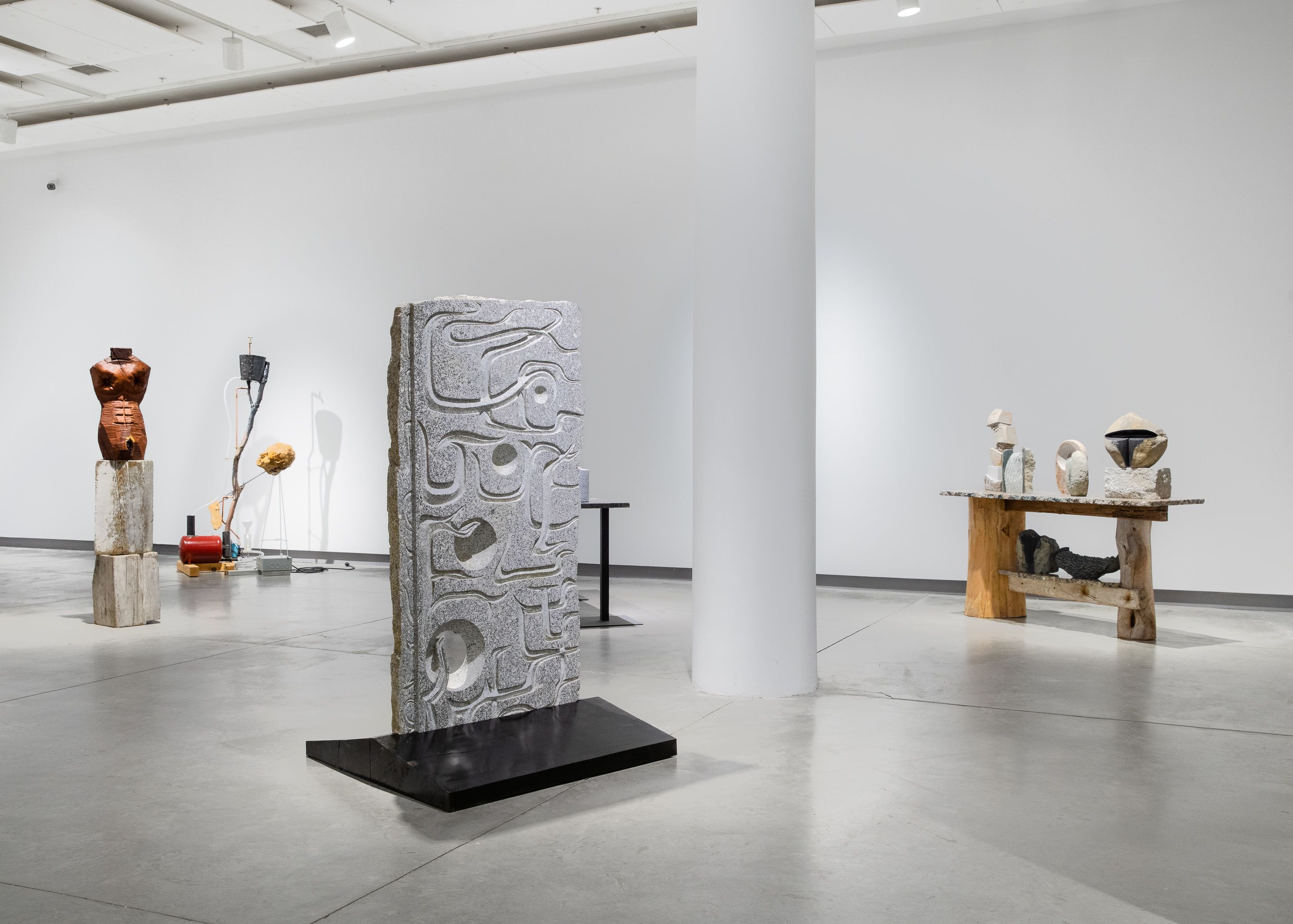 Installation view of a carved stone sculpture.