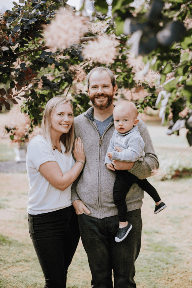 Jason and his family pose for photo