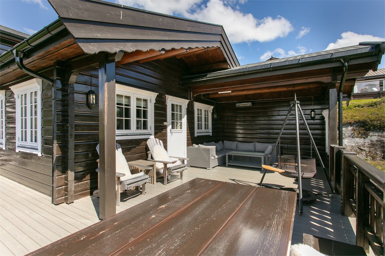 Terrasse med overbygd utestue