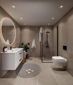 Moderne og stilfullt bad med store fliser på gulv og vegger.