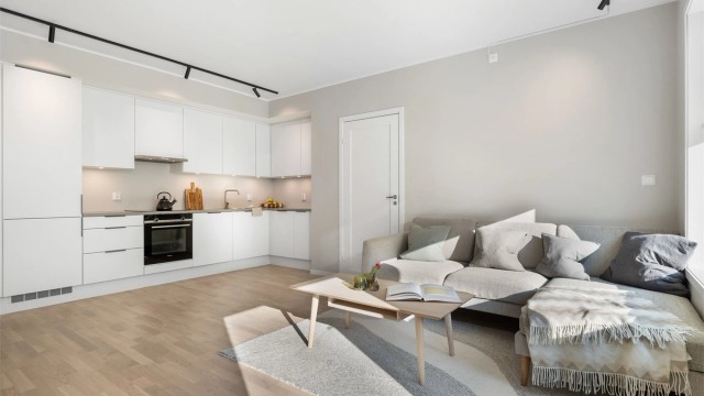 Den åpne planløsningen gjør matlagingen til en sosial aktivitet og serveringen svært enkel