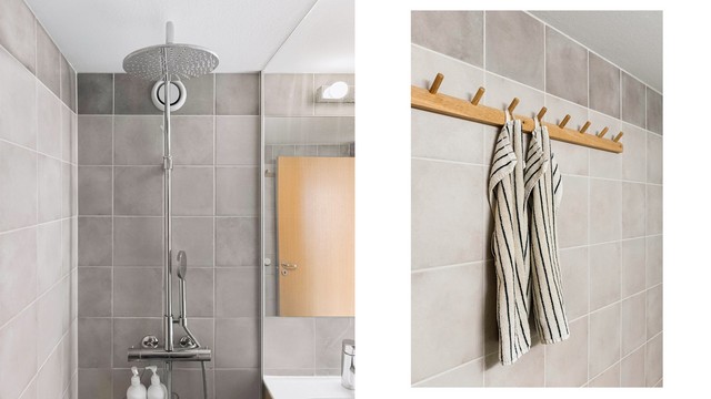 Dusjarmatur i krom og praktiske opphengsløsninger gjør badet like funksjonelt som det er innbydende.