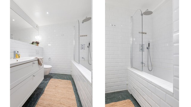 Baderommet ble pusset opp i 2021 med flislagte overflater, gulvvarme og badekar med dusj, veggmonterte Flos Lamper og marmor på gulv. Foto: Trond Walsø / Walso Work