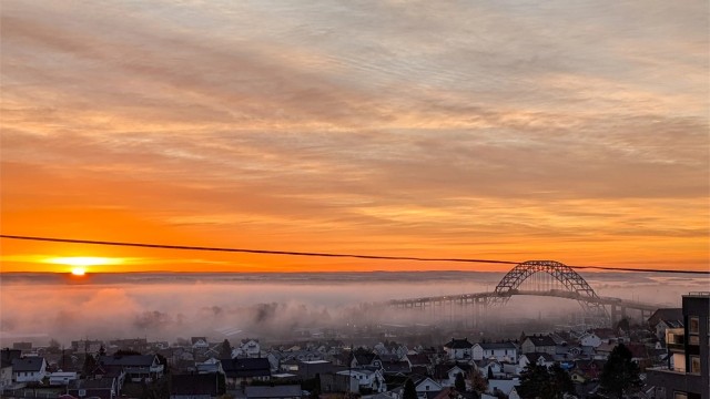 Se byen våkne fra din egen stue