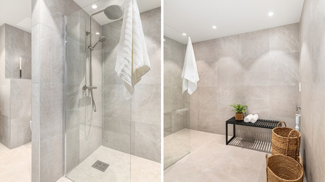 Nye storformat fliser på gulv og vegger gir badet helhet. Himlingen er også ny og nedsenket med innfelte spotter.