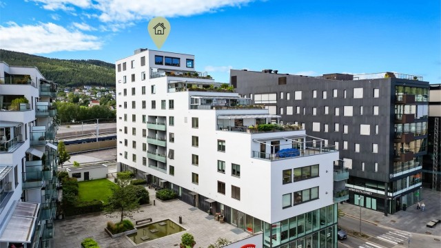 Flott atrium mellom bygningene som er forbeholdt beboerne.