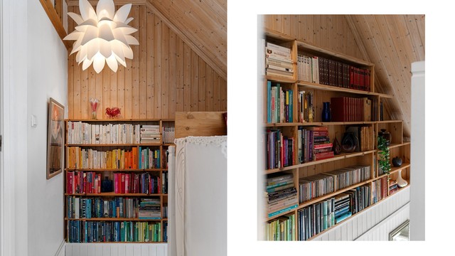 En stor, plassbygget bokhylle utnytter plassen under taket.
