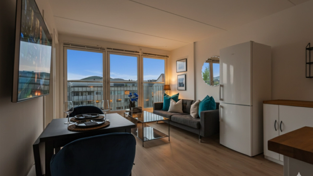 Krogsveen v/Sondre Trøseng Gjellum ønsker velkommen til Strømsø Torg 5E! Digitalt redigert kveldsbilde. Foto: Trond Reder