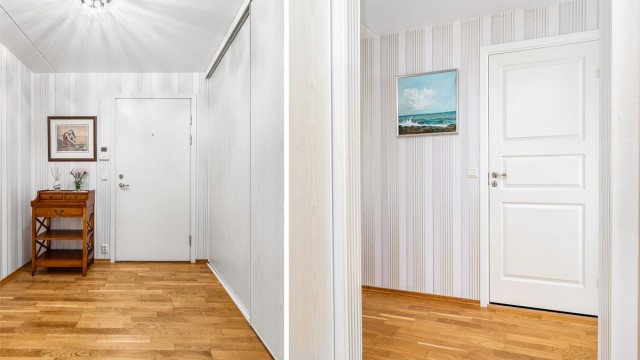 Den romslige entreen er et representativt første møte med leiligheten og utstyrt med skyvedørsgarderobe.