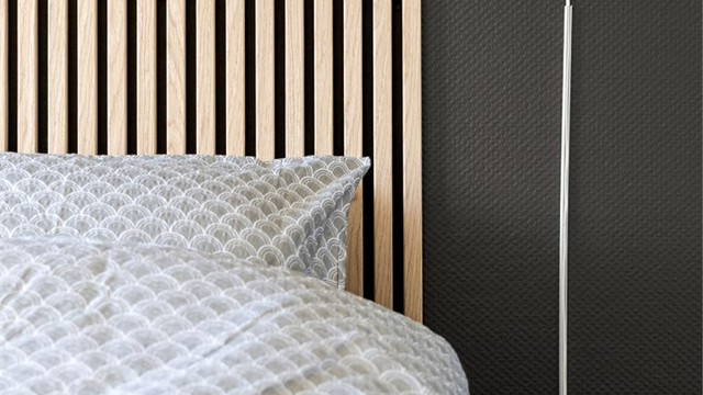 En moderne spilevegg fungerer som en stilfull sengegavl.