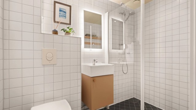 Flislagt bad fra 2009 med gulvvarme og downlights i himling