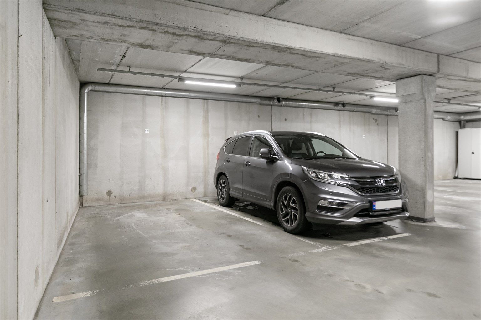 Fast parkeringsplass i felles underjordisk garasjeanlegg.