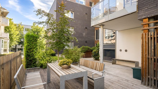 Sameiets felles atrium er etablert som et møtepunkt for beboerne.
