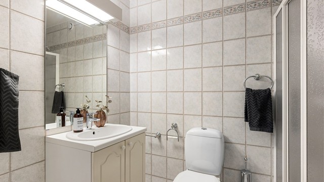 Flislagt bad fra byggeår med gulvvarme.