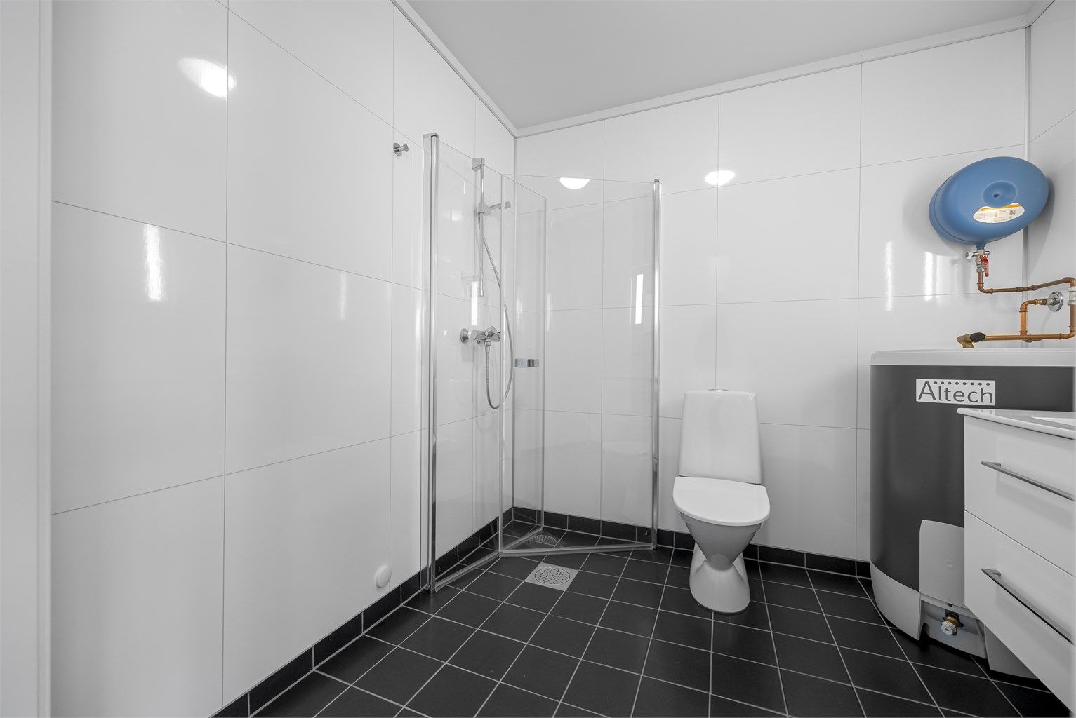 Bad/vaskerom med gulvvarme.