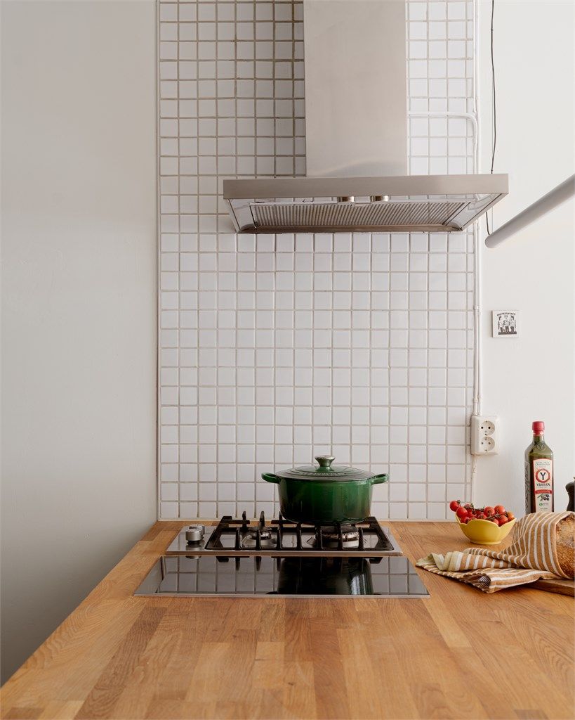 Lekre materialkombinasjoner på kjøkkenet gjør det til en fest for den som er glad i matlaging!