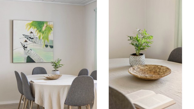 Stemningsfull detalj fra spiseplassen, hvor lyse overflater og store vindusflater skaper en luftig romfølelse.