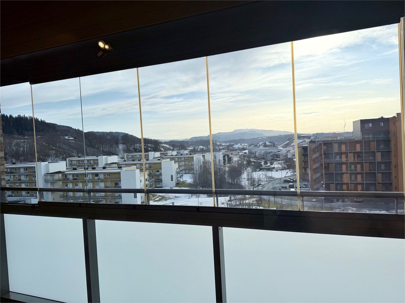 Innglasset terrasse som kan åpnes.